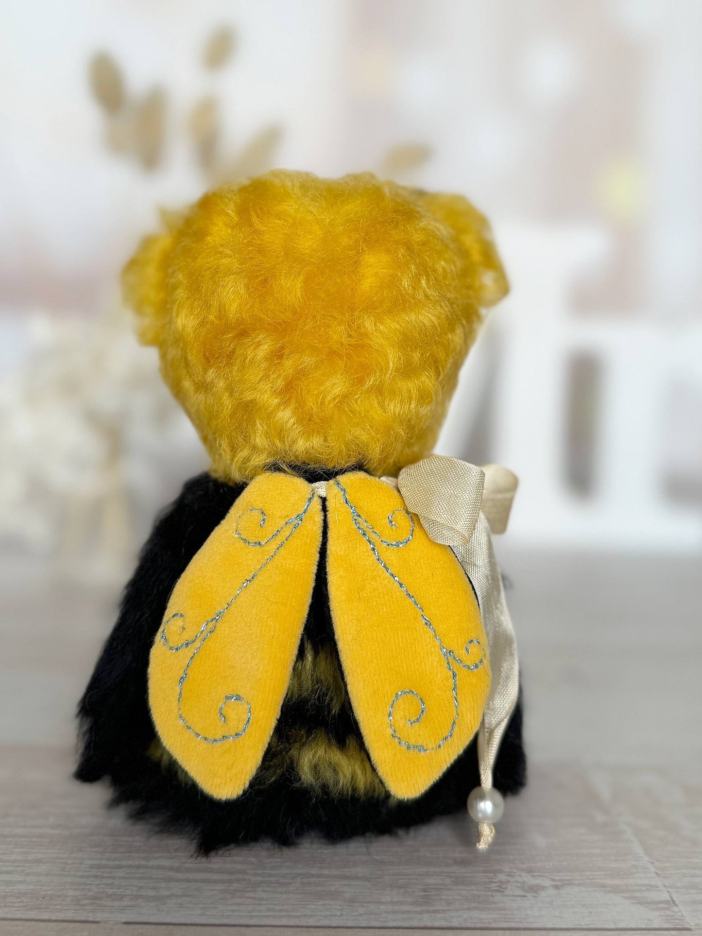 Little Sunny Bee mohair bear with yellow wings and playful antennae, detail view