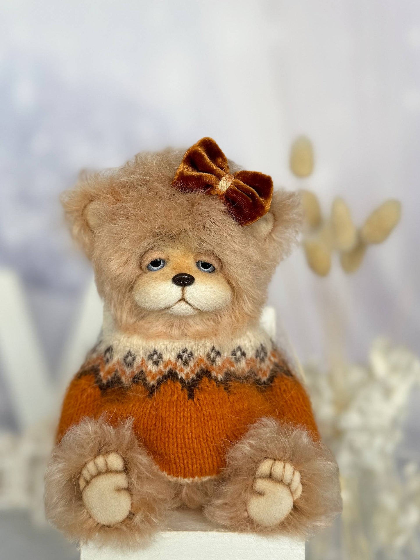 Close-up of handmade teddy bear Alma showing detailed craftsmanship