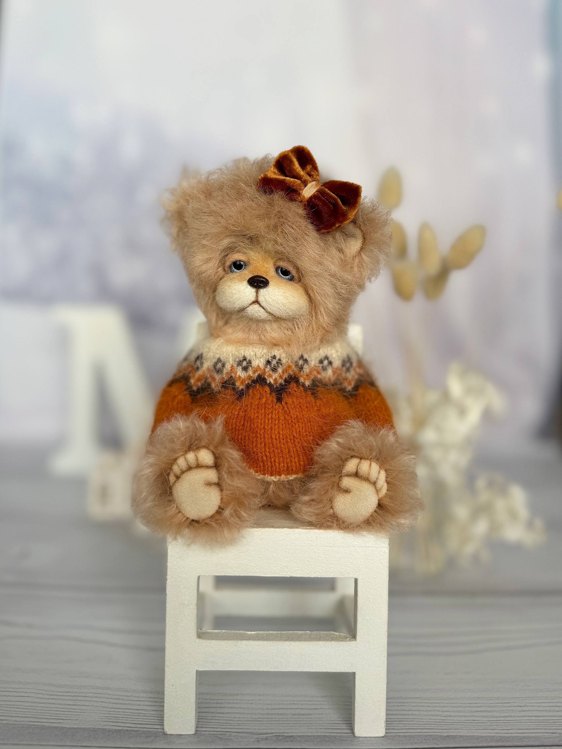 Close-up of handmade teddy bear Alma showing detailed craftsmanship