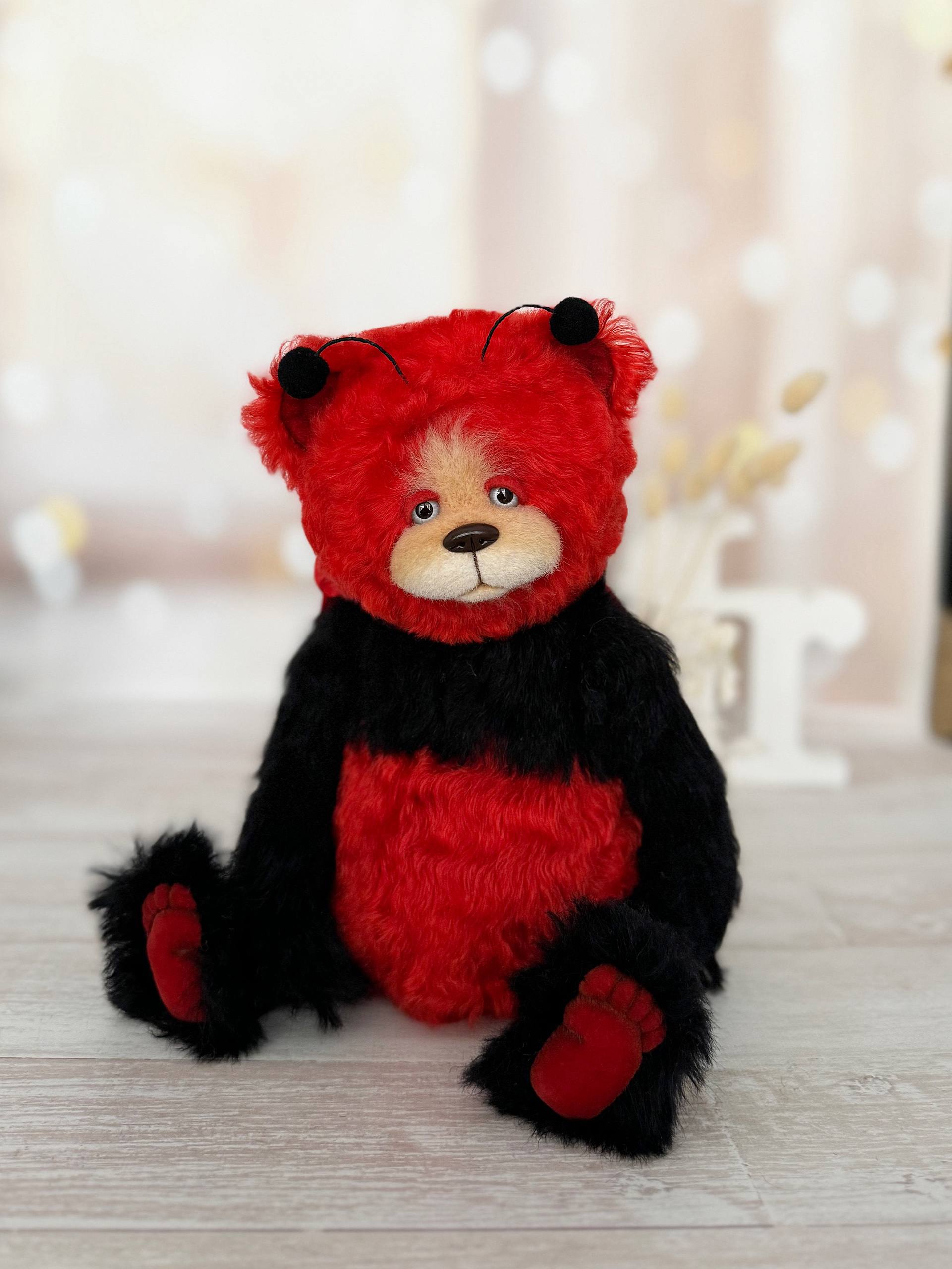 Handmade mohair teddy bear Scarlet Ladybug Deluxe in ladybug costume, front view